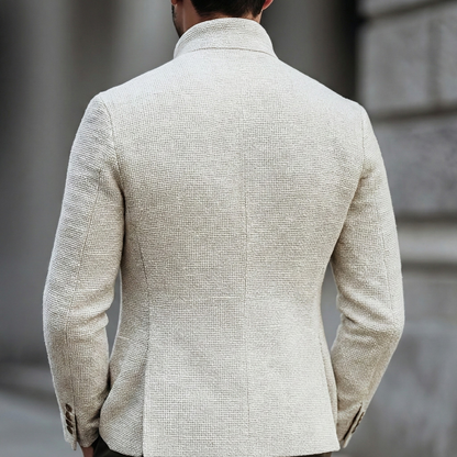 Men's cream knit cardigan styled with tailored trousers